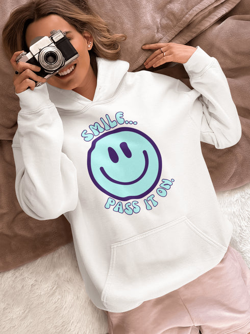 Introducing the ultimate mood booster in fabric form: the "Smile…Pass It On" Happy Face Hoodie! This isn't just any ordinary hoodie; it's a wearable ray of sunshine, guaranteed to spread joy, high-fives, and possibly even spontaneous dance-offs wherever you go.
